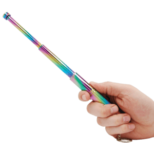 A hand holding a rainbow stick.