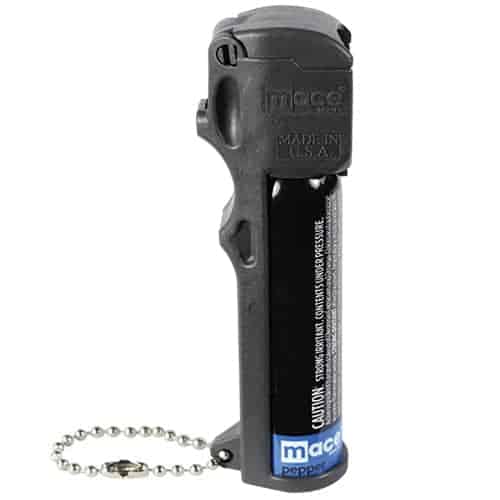 A black handgun with a chain attached to it, featuring Mace® Triple Action Personal Pepper Spray for personal protection.
