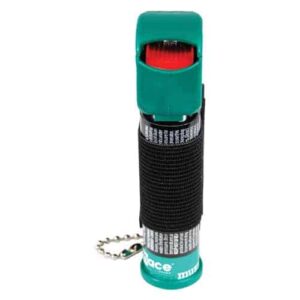 A green and red Mace® Canine Repellent-keychain combo.