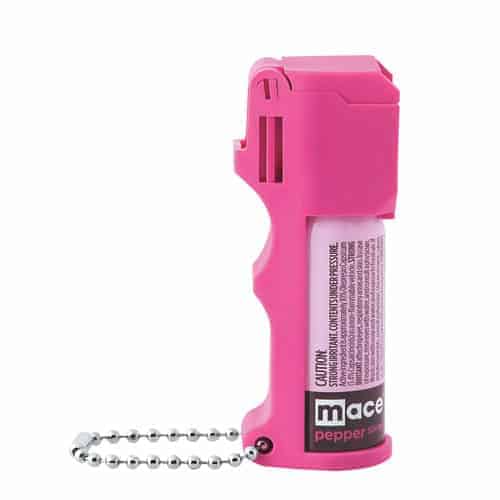 A pink fire extinguisher with a chain on it, resembling a Mace Hot Pink Pepper Spray Pocket Model.