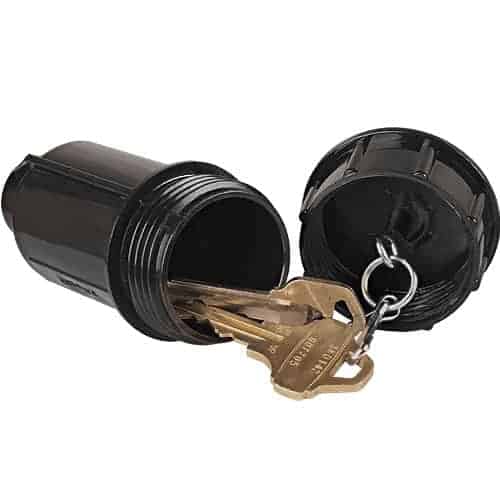 A black plastic Sprinkler Head Key Hider Diversion Safe with two keys, doubling as a key hider.