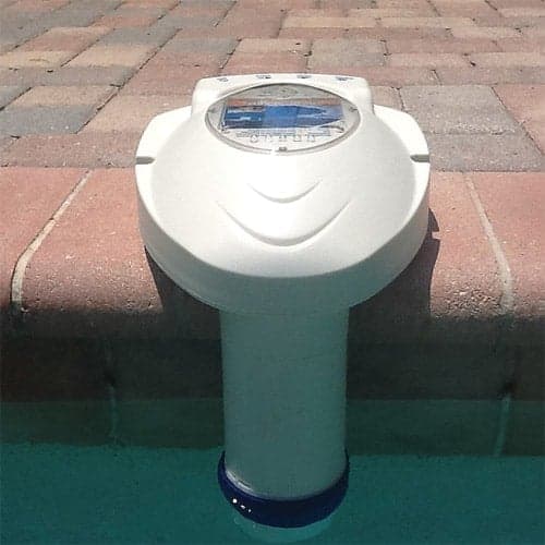 A pool with a pool alarm attached to the side, providing an efficient system for monitoring water usage.