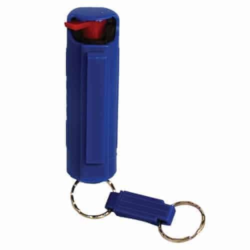 A blue bottle with a Pepper Shot 1.2% MC 1/2 oz Pepper Spray Hard Case Belt Clip and Quick Release Key Chain attached to it, containing Pepper Spray.