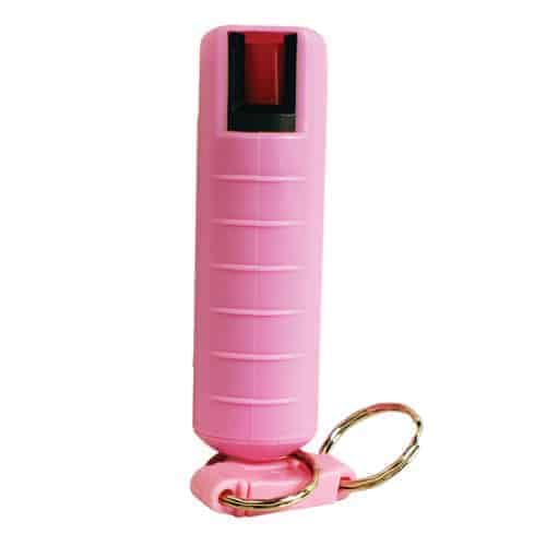 A pink bottle with a Pepper Shot 1.2% MC 1/2 oz Pepper Spray Hard Case Belt Clip and Quick Release Key Chain attached to it.
