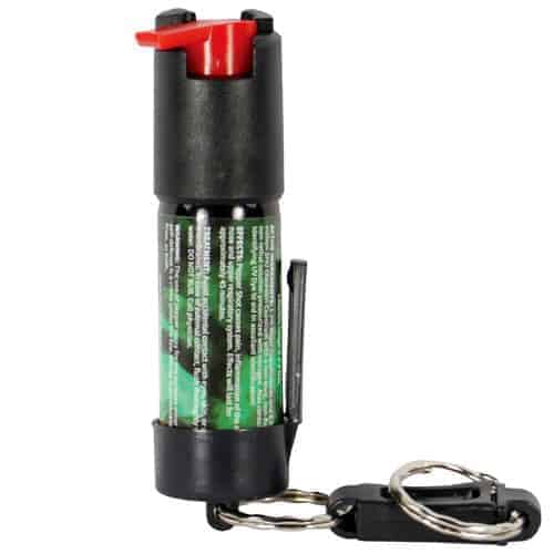 A key ring with a Pepper Shot 1.2% MC 1/2 oz Pepper Spray Belt Clip and Quick Release Key Chain attached to it.