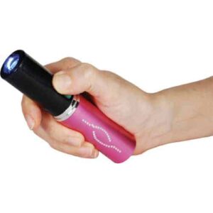 A hand holding a Lipstick Stun Gun Rechargeable With Flashlight.