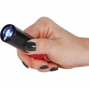 A person holding a Lipstick Stun Gun Rechargeable With Flashlight in their hand.