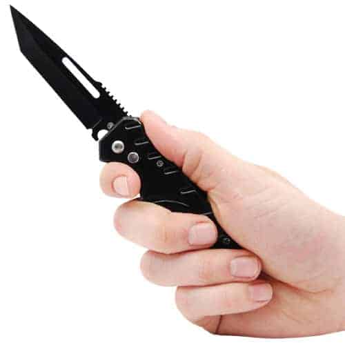 A person's hand holding an Automatic Heavy Duty Knife with a 5 hole handle.