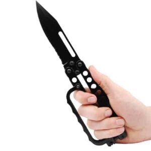 A person's hand holding a Butterfly Trench Knife Black on a white background.