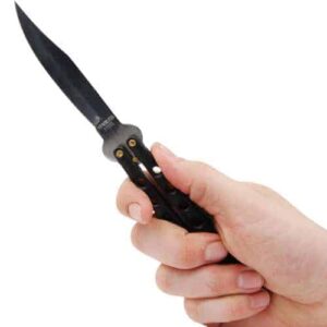 A person's hand holding a Butterfly Knife Black on a white background.