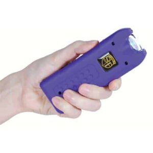 A person holding a MultiGuard Stun Gun Rechargeable With Alarm and Flashlight.