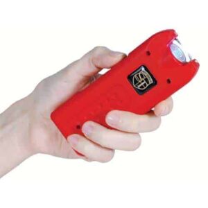 A person holding a MultiGuard Stun Gun Rechargeable With Alarm and Flashlight in their hand.