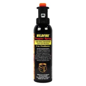 A bottle of wildfire spray, also known as 1.4% MC Pepper Spray Fogger, on a white background.