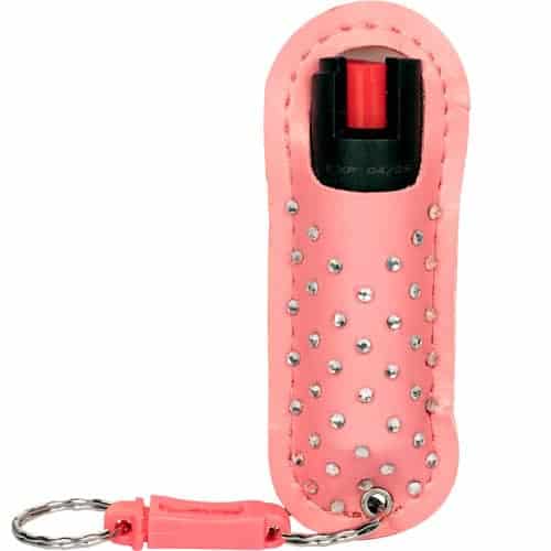A pink key ring with studs on it, perfect for the WildFire™ 1.4% MC 1/2 oz Halo Holster.