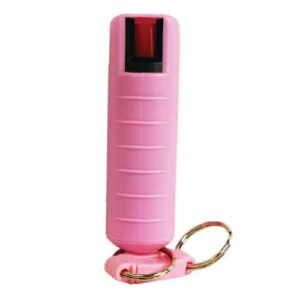 A pink bottle with a Wildfire 1.4% MC 

½ oz Pepper Spray Hard Case key ring attached to it.