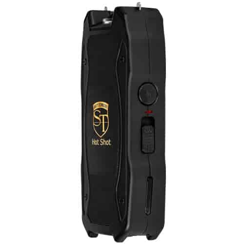 A black and gold Hot Shot Stun Gun/Flashlight with a gold logo that includes a battery meter.