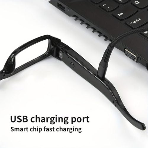 Eyeglasses Hidden Spy Camera with Built in DVR connected to a laptop via a USB charging cable. Text reads "USB charging port - Smart chip fast charging.