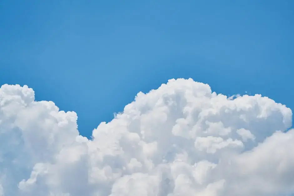 Large, fluffy white clouds against a clear blue sky.