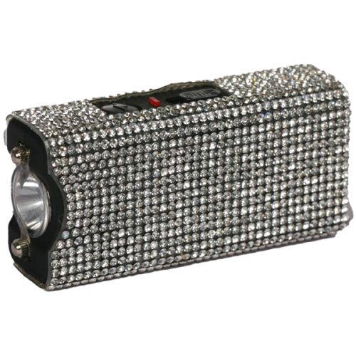 The Rhinestun Keychain Stun Gun is a rectangular flashlight embellished with rhinestones, featuring a visible bulb on one end and a top switch. It's compact enough for any keychain, offering practicality and sparkle for your daily needs.